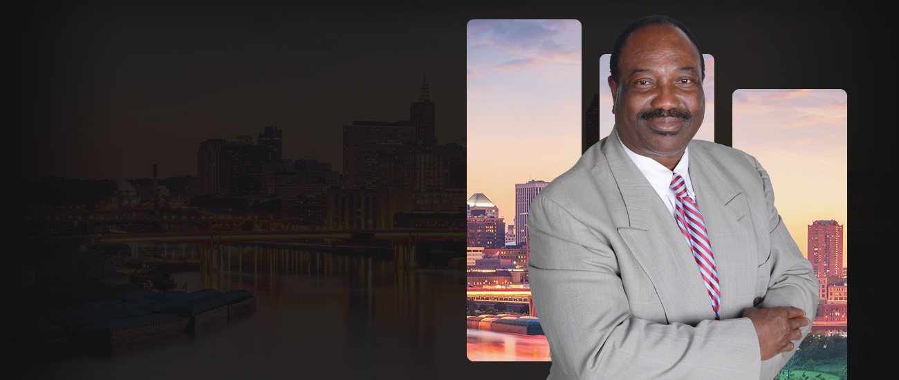 John Akwuba with St Paul Skyline in the background