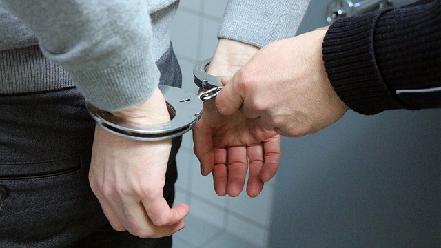 Man being hand cuffed